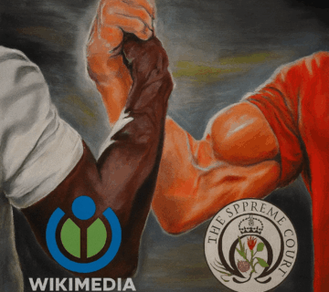 Illustration of two muscular arms, one in a white shirt and darker skin tone and the other in a red shirt with lighter skin tone, clasping hands in a strong handshake. The Wikimedia Foundation logo appears near the left arm, and the UK Supreme Court logo appears near the right arm, set against a muted background